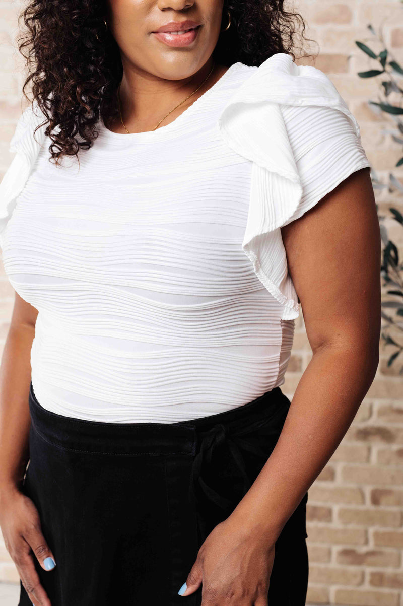 Blusa con mangas con volantes de Highest Praise