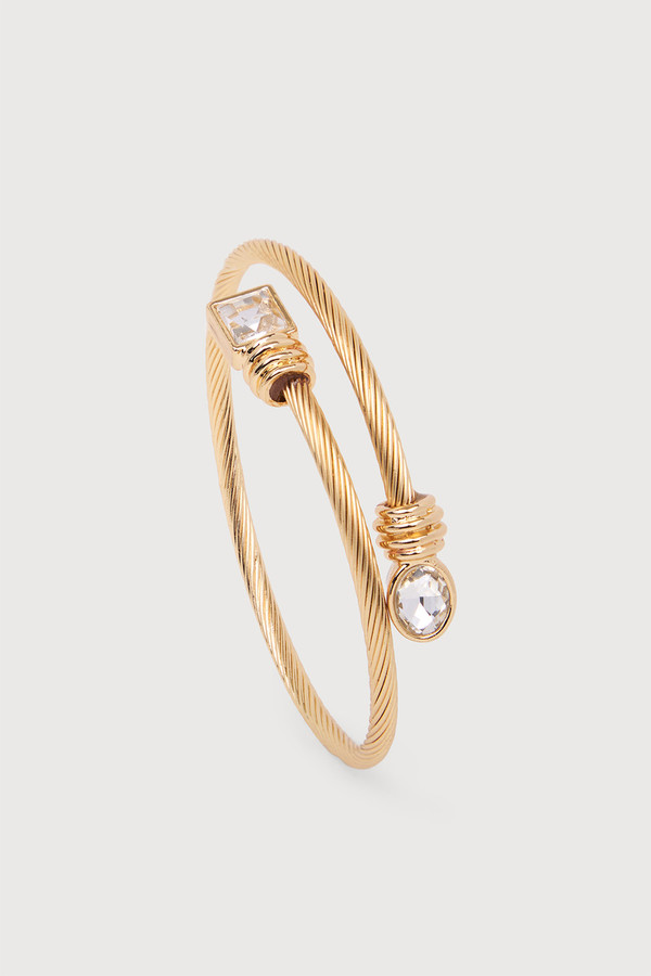 Golden Twist Gem Cuff bracelet by SAACHI featuring a metal band with a twisted design and gemstone accents.