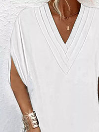 Plus size Trendsi full size V-neck mini dress with slit sleeves, featuring a stylish and elegant design.