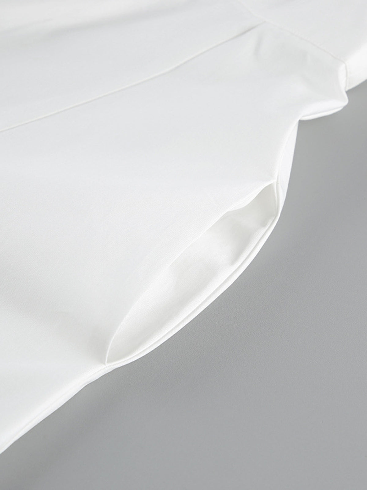 Backless button-front maxi dress from Trendsi, featuring a flowing silhouette and elegant design, perfect for summer occasions.