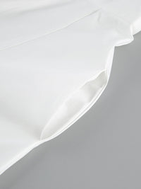 Backless button-front maxi dress from Trendsi, featuring a flowing silhouette and elegant design, perfect for summer occasions.