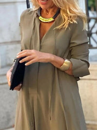 Solid color maxi shirt dress by Trendsi, featuring a relaxed fit and button-down front, perfect for casual outings.