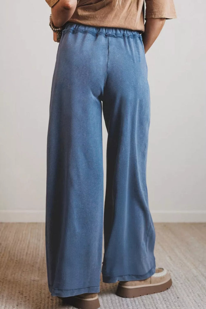Relaxed fit drawstring jeans from Trendsi, showing the casual denim with a relaxed silhouette and adjustable waistband.