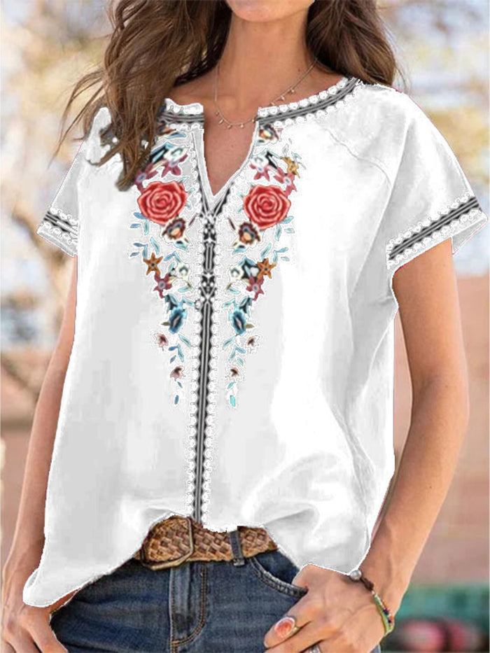 Floral notched short sleeve blouse from Trendsi featuring a stylish design and comfortable fit, perfect for casual or office wear.