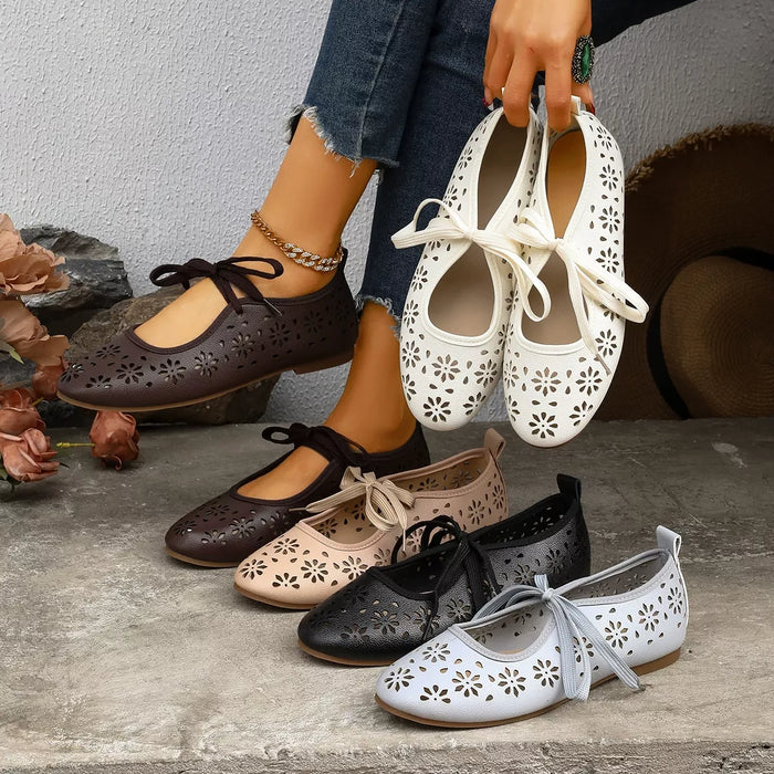 Floral cutout tied slip-on shoes from Trendsi featuring a stylish design and breathable fabric, perfect for casual wear.