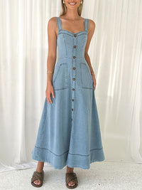 Button-front A-line denim dress from Trendsi featuring a casual, stylish design with a fitted bodice and flared skirt.