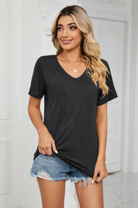 Soft beige Essential V-Neck Tee by Trendsi, showcasing a fitted V-neck blouse made of lightweight fabric.
