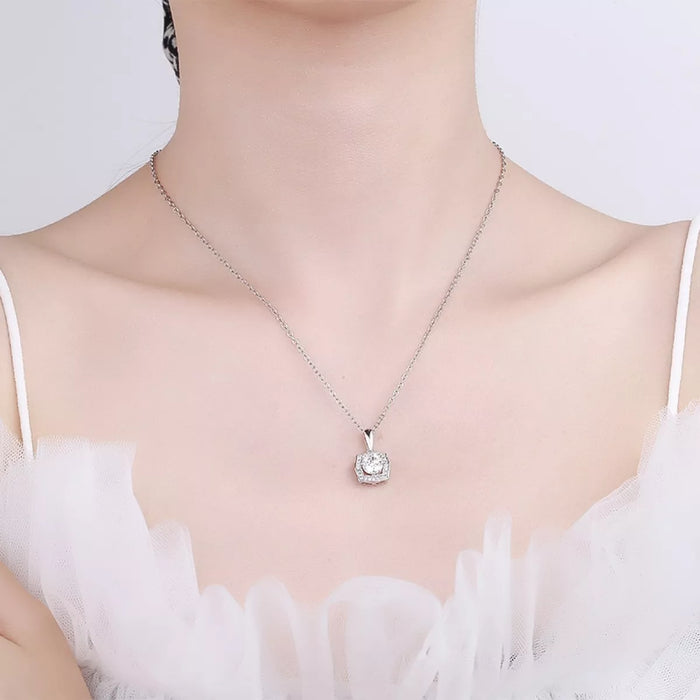Sterling silver Aurore 1ct moissanite necklace featuring a sparkling gemstone pendant on a delicate chain.