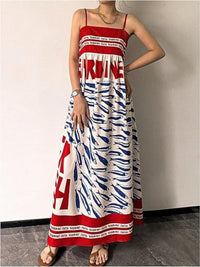 Sardine print spaghetti strap maxi dress by Trendsi featuring a flowy silhouette and bold fish pattern.