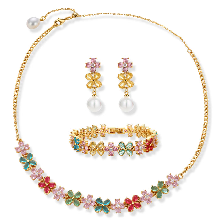 Gold-plated jewelry set with pink, turquoise and red flower-shaped cubic zirconia stones, featuring necklace, earrings and bracelet.