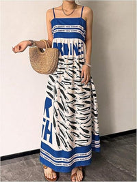 Sardine print spaghetti strap maxi dress by Trendsi featuring a flowing silhouette and stylish print for casual or summer wear.