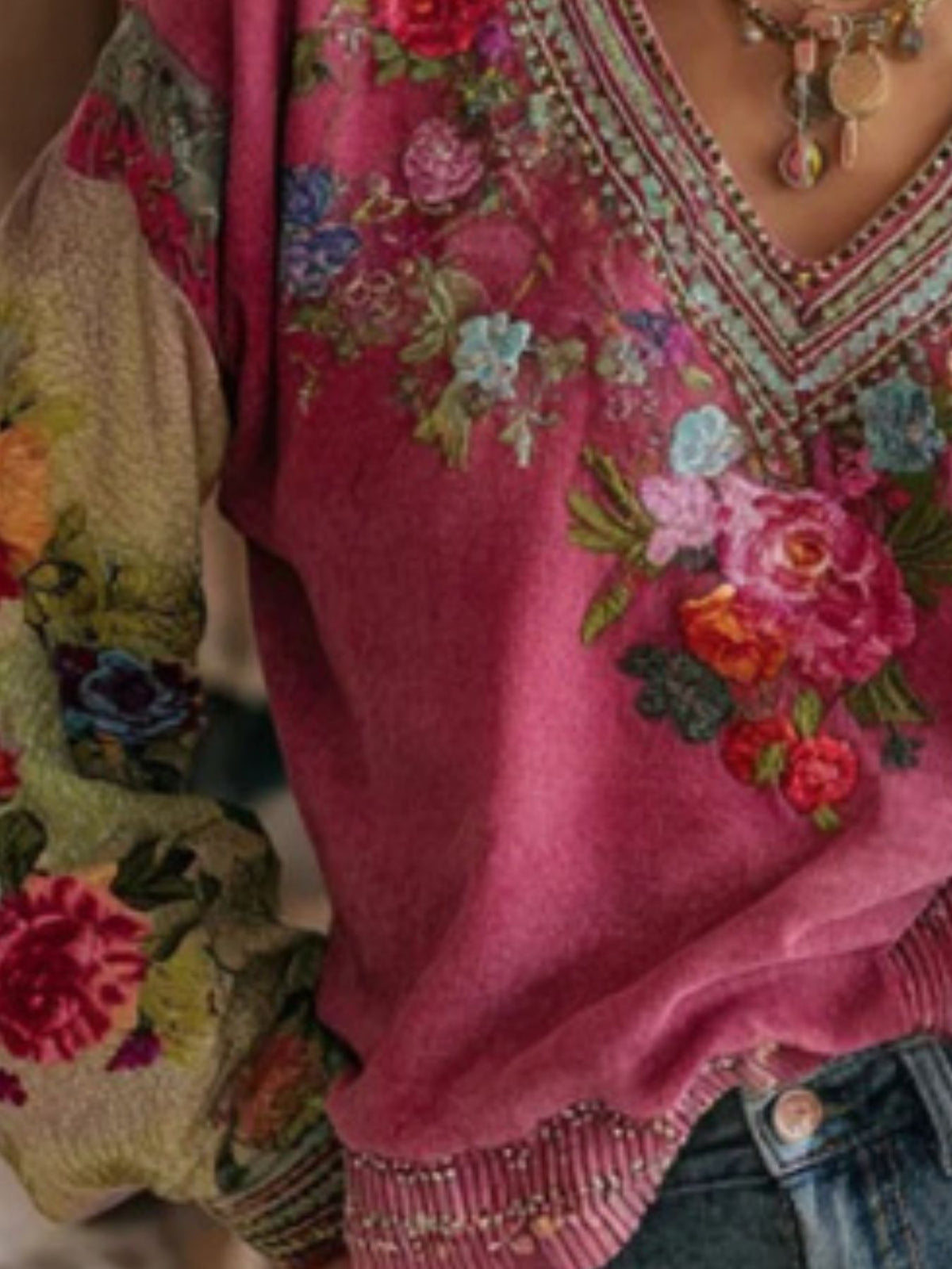 Floral embroidered V-neck blouse from Trendsi, featuring colorful embroidery and lightweight fabric, perfect for casual wear.