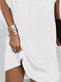 Full size Trendsi V-neck mini dress with slit sleeves in a stylish design, showcased on a model.