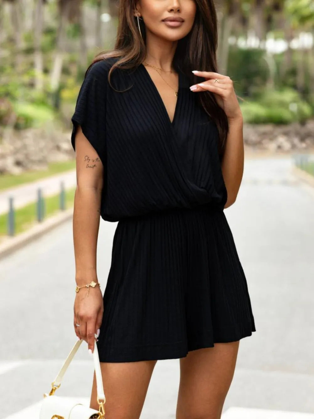 Trendsi surplice short sleeve romper in a stylish design, featuring a relaxed fit and soft fabric.