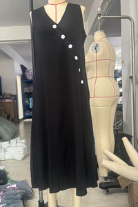 Sleeveless button-down midi dress from Trendsi featuring a relaxed fit and stylish design, perfect for casual or semi-formal wear.