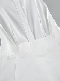 Backless button-front maxi dress by Trendsi featuring a flowing silhouette and elegant design, perfect for summer or special occasions.