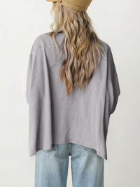 Square crochet detail loose T-shirt from Trendsi, casual blouse with crochet accents, soft fabric and relaxed fit.