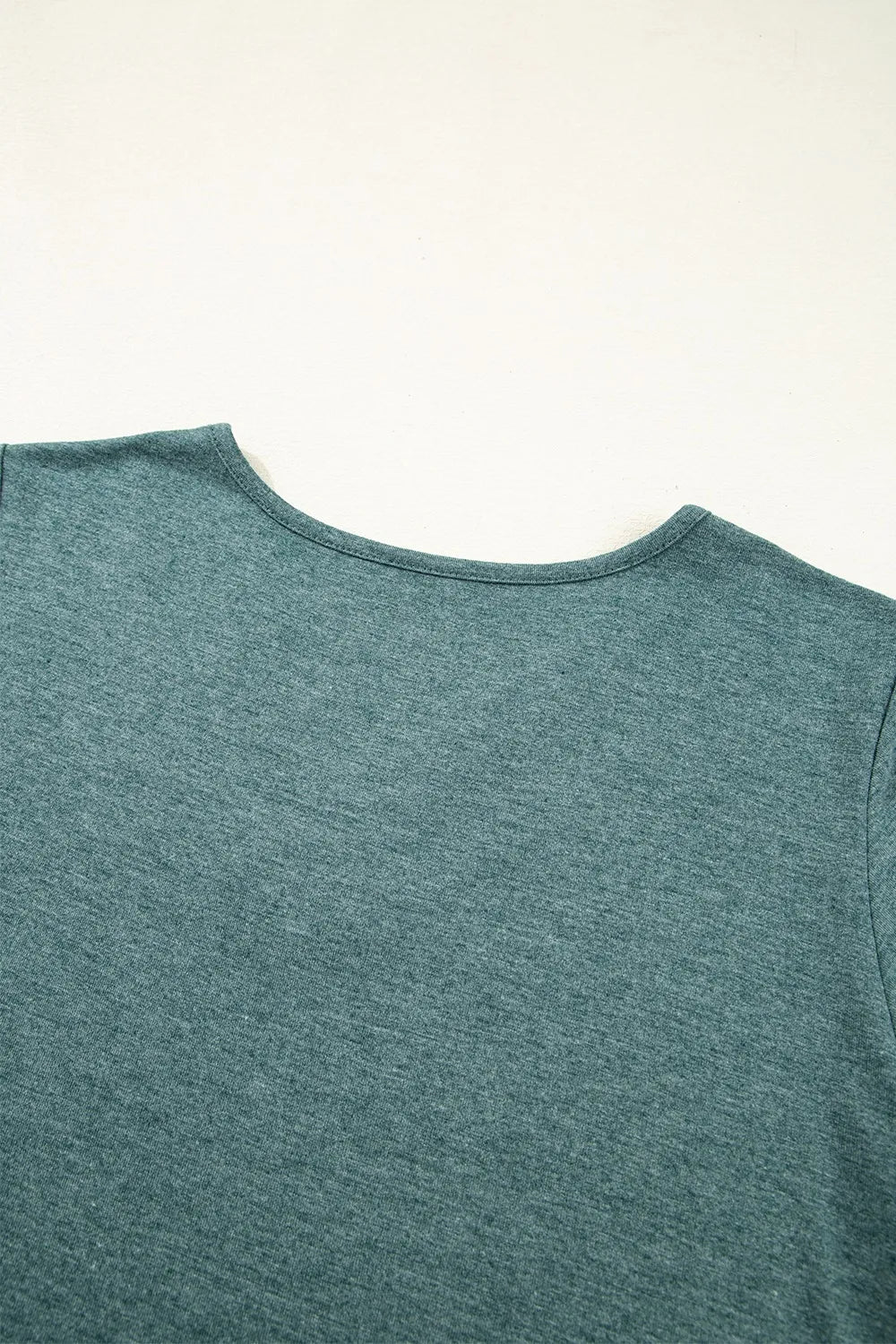 Classic V-Neck Tee from Trendsi, casual blouse or shirt in soft fabric, featuring a V-neck neckline and relaxed fit.