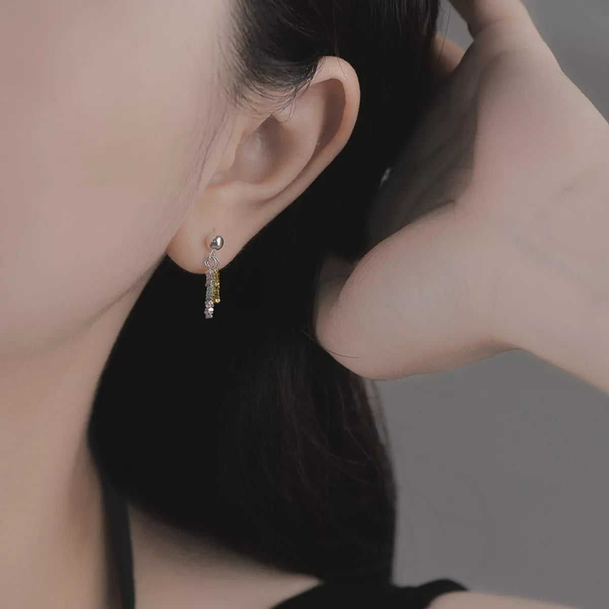 Delicate chain drop earrings with thin gold chains and small dangling accents, stylish jewelry by Trendsi.