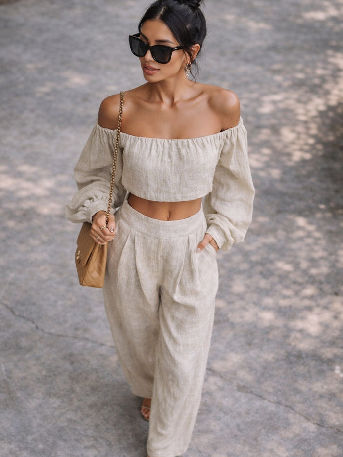 Trendsi Riviera off-shoulder crop top and wide-leg pants set, two-piece outfit, in light, airy fabric with a relaxed fit.