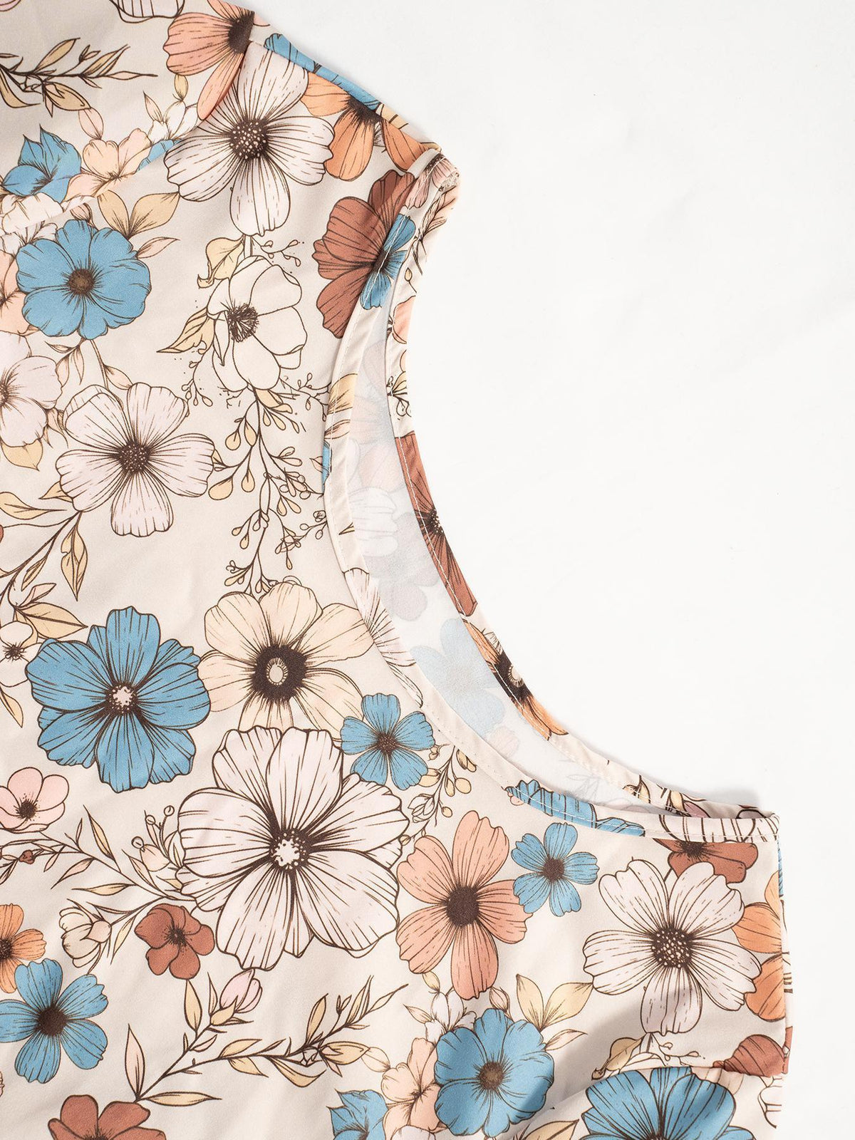 Floral print long sleeve tiered dress by Trendsi with a flowy silhouette and vibrant floral pattern.