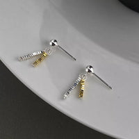 Delicate chain drop earrings by Trendsi featuring thin gold chains and small pendant accents, elegant jewelry for special occasions