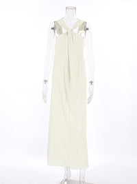 Halter neck maxi dress by Trendsi, featuring a flowing silhouette and sleeveless design, perfect for summer occasions.