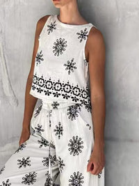 Trendsi sleeveless top and wide-leg pants two-piece set, stylish casual outfit with sleeveless top and flowy wide-leg pants.