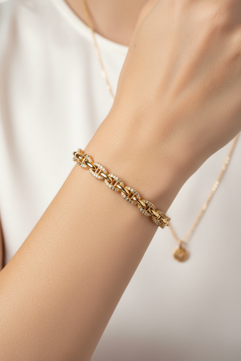 Gold bracelet on model's wrist