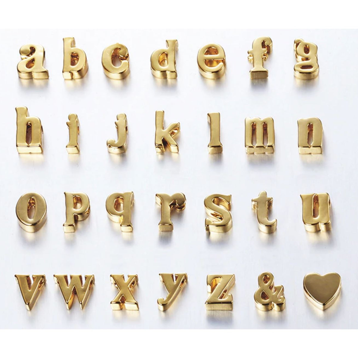 Mini initial necklace by Sahira Jewelry Design featuring a delicate pendant with a personalized initial on a fine chain.