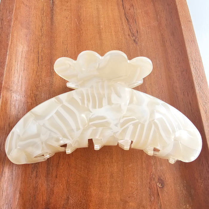 Ivory Brielle Hair Claw by Spiffy & Splendid, a stylish hair accessory with a sleek design for securing hair.