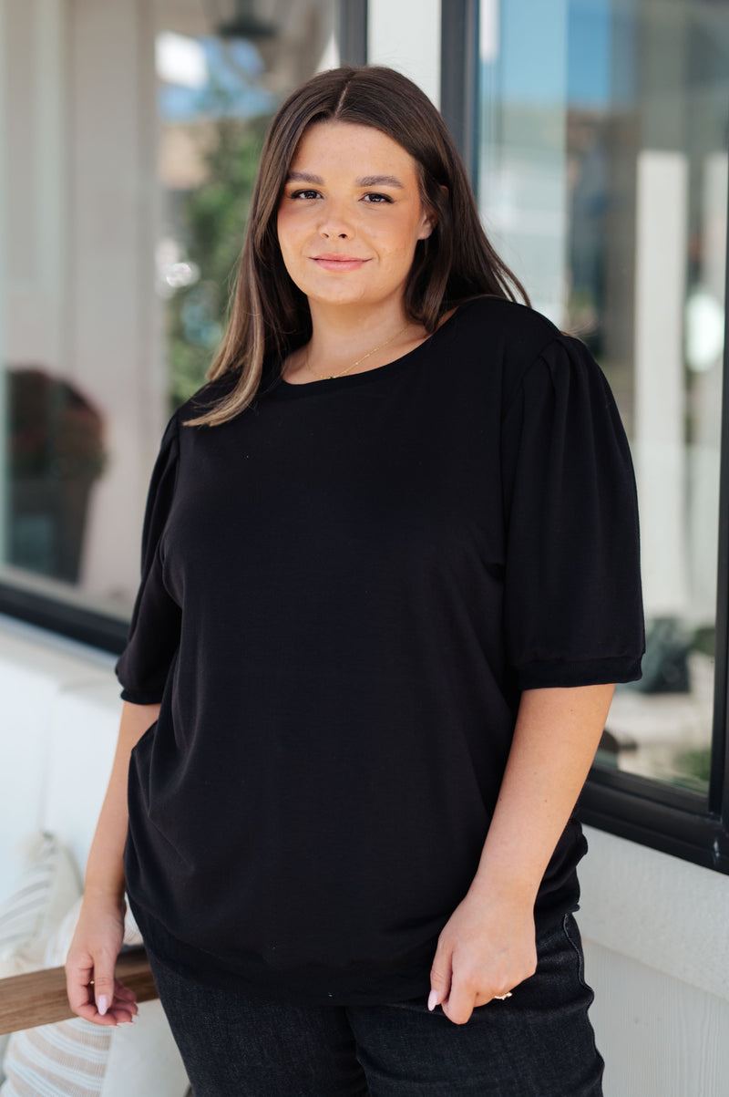 Top con mangas abullonadas Evidentemente diferente