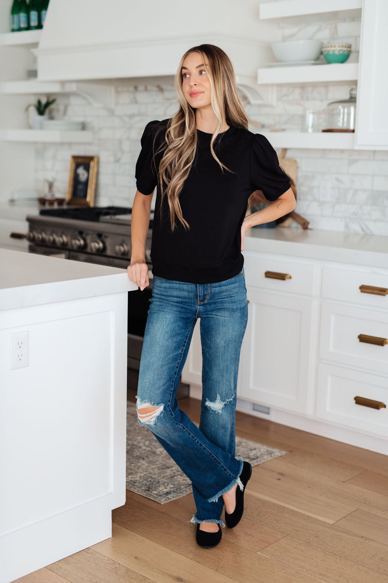 Top con mangas abullonadas Evidentemente diferente